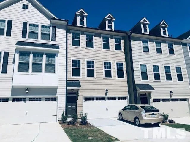 a front view of a building with parking space