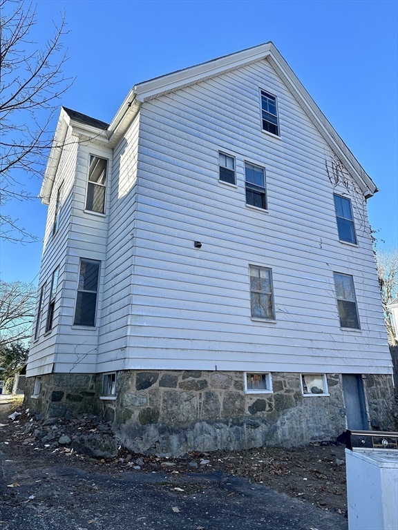 183 Temple Street Boston, MA 02132 - Photo 14 of 15 a front view of a house with a yard