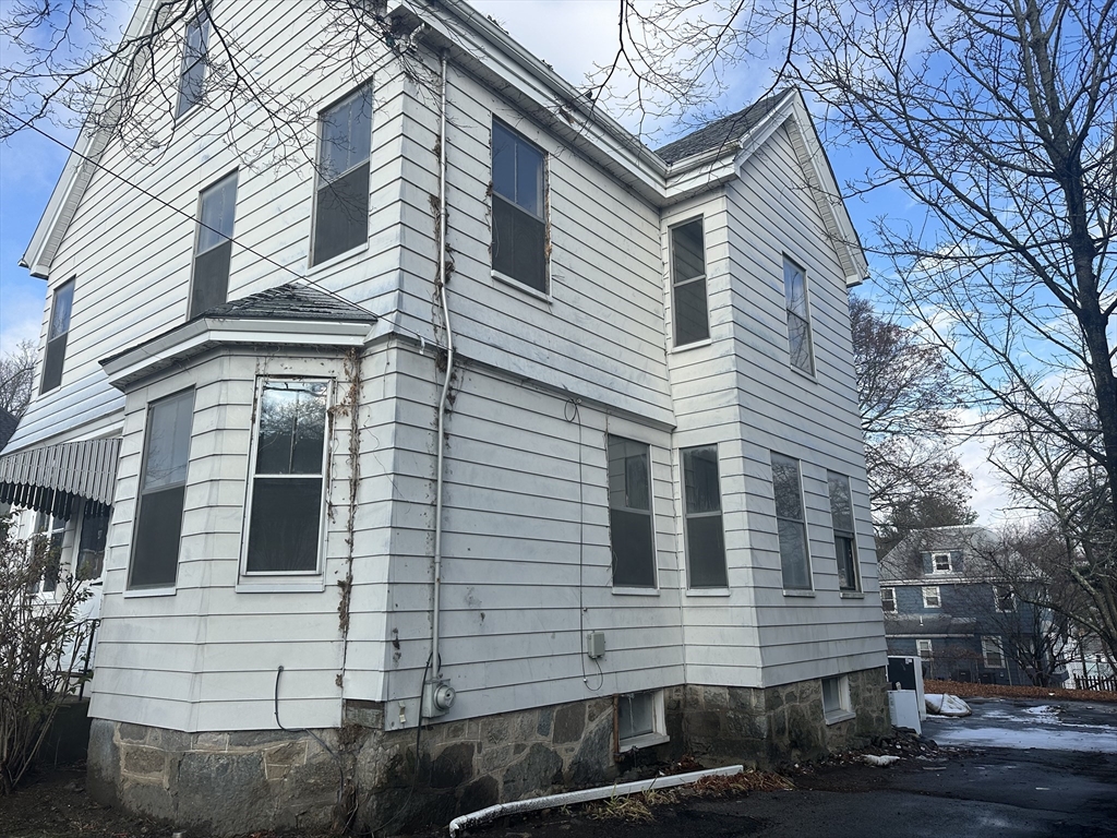 183 Temple Street Boston, MA 02132 - Photo 15 of 15 a front view of a house with a yard