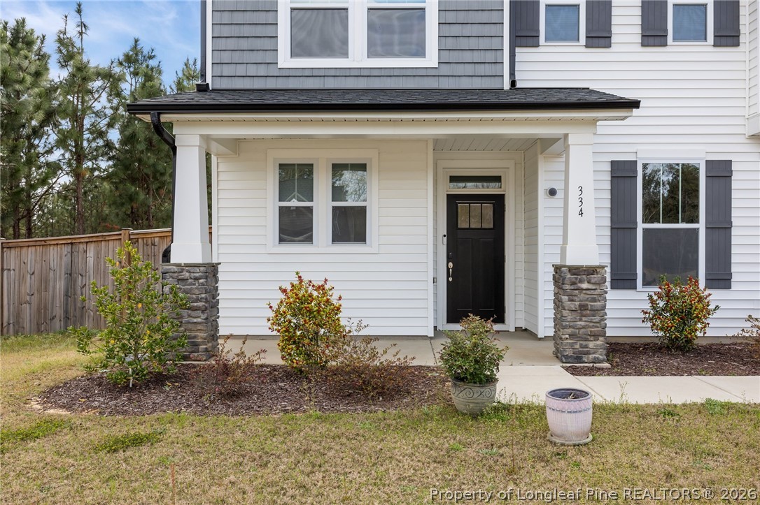 334 Beacon Hl Road Lillington, NC 27546 - Photo 2 of 49 a front view of a house with a yard