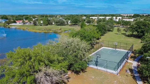 an aerial view of a house with a lake view
