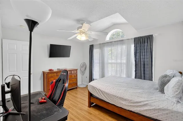 a bathroom with a toilet and shower curtain