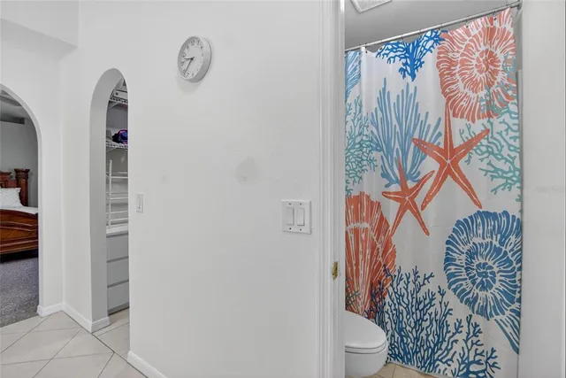 a bedroom with furniture a baby crib a desk and a book shelf