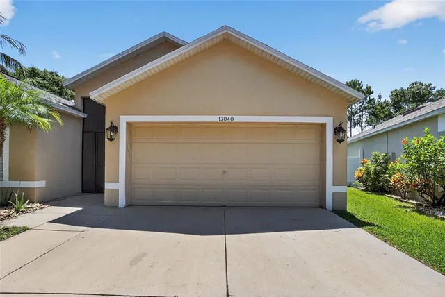 a view of backyard of house and garage