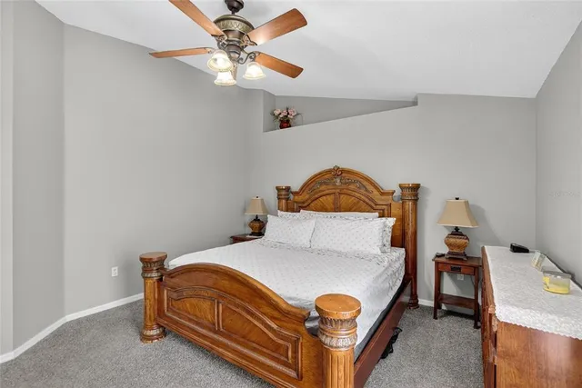 a kitchen with a sink and a stove top oven with wooden floor