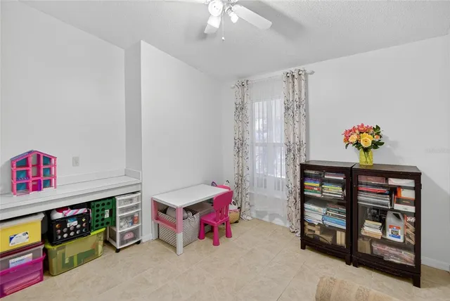 a dining room with furniture and chandelier