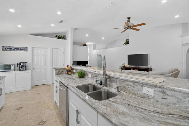 a view of a house with backyard porch and sitting area