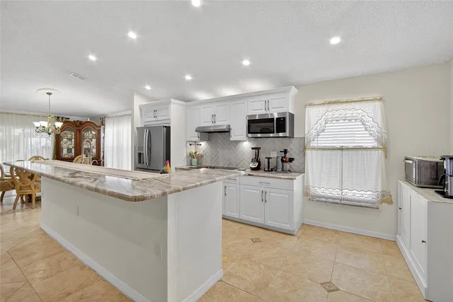a view of a house with a yard porch and sitting area