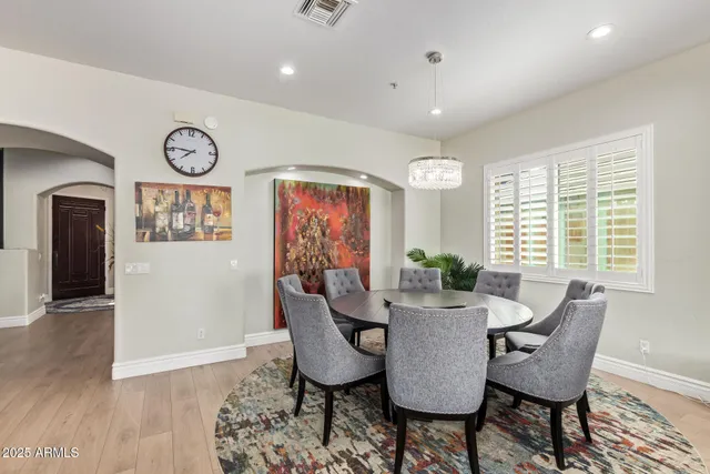 a kitchen with stainless steel appliances kitchen island granite countertop a stove a sink and a refrigerator