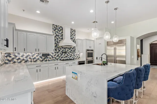 a bathroom with a sink and a mirror with shower