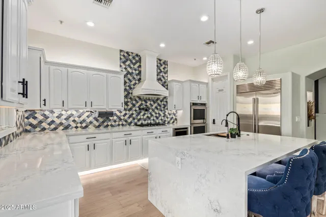a kitchen with a sink and stove