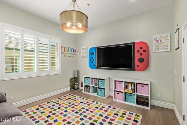 a room that has a dresser and a window in it