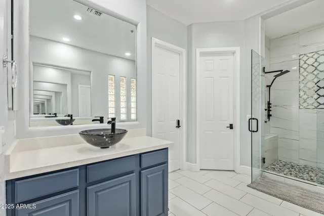 a bed room with a bed and a chair