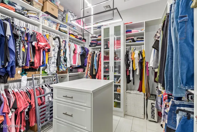 a view of a workspace with furniture and wooden floor