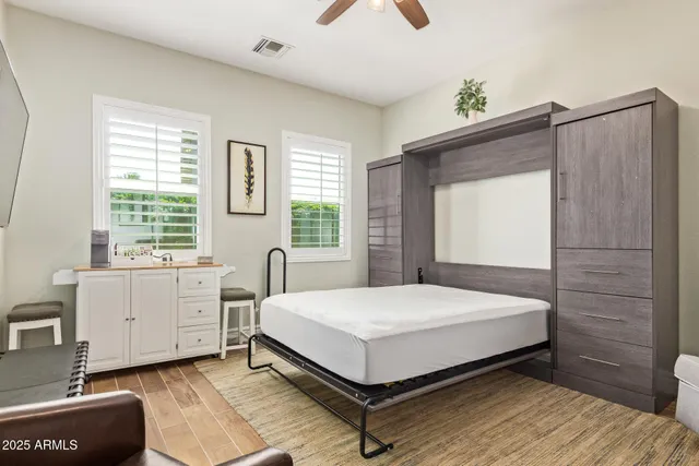 a view of a hallway with seating area