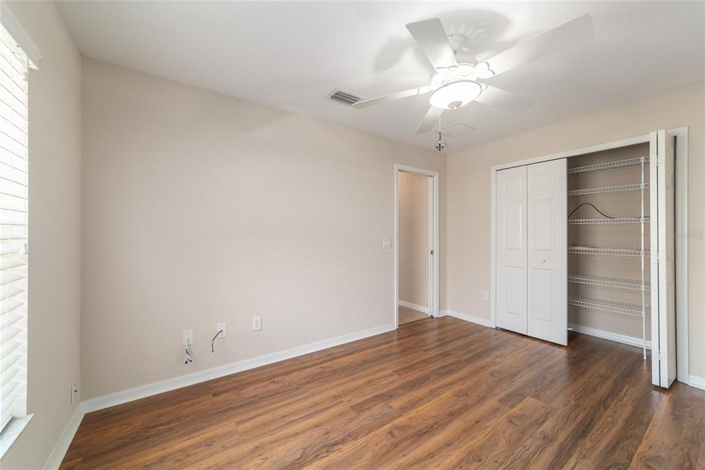 16369 Southwest 14th Avenue Road Ocala, FL 34473 - Photo 38 of 49 wooden floor in an empty room with a window