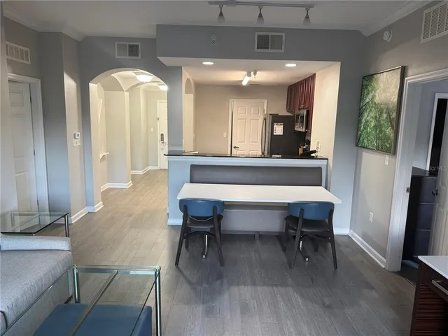 a bedroom with a bed and a night stand