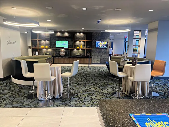 a living room with furniture a flat screen tv and rug