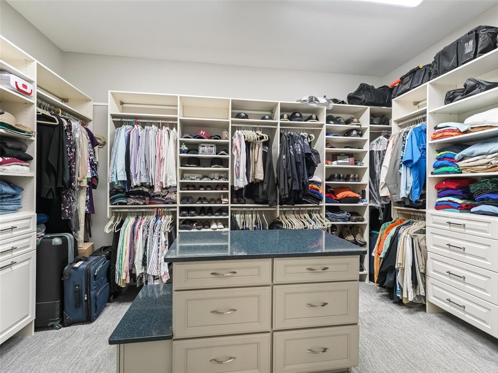 19331 East Levy Street Williston, FL 32696 - Photo 29 of 81 a view of walk in closet with clothes