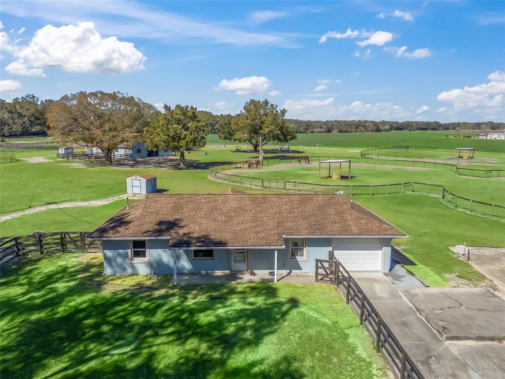 19331 East Levy Street Williston, FL 32696 - Photo 42 of 81 an aerial view of a house with a yard basket ball court and outdoor seating