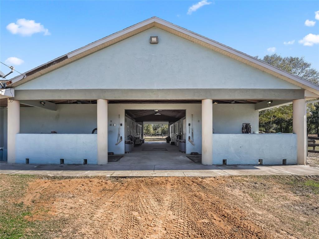 19331 East Levy Street Williston, FL 32696 - Photo 64 of 81 a front view of a house with a yard and garage