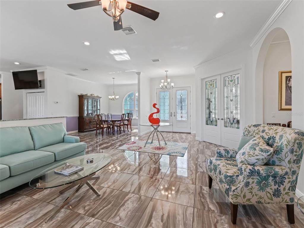 19331 East Levy Street Williston, FL 32696 - Photo 10 of 81 a living room with furniture and a flat screen tv