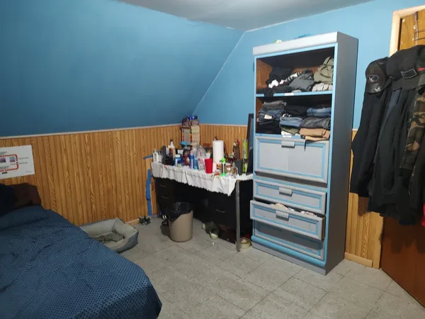a view of an empty room and wooden floor