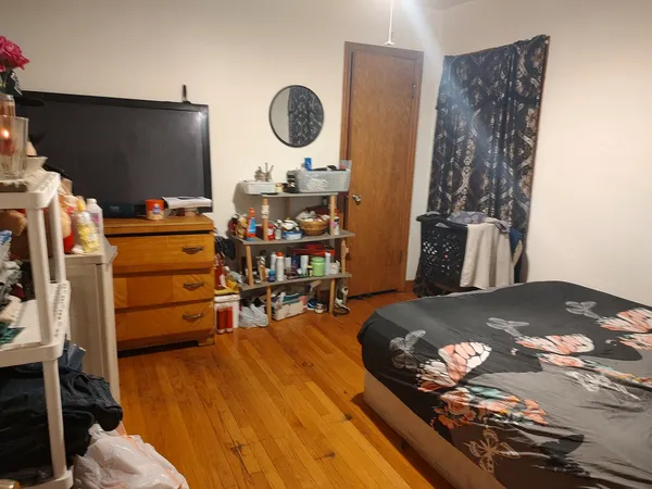 a bedroom with a bed and a table in it