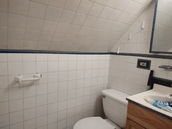 a bathroom with a toilet and sink