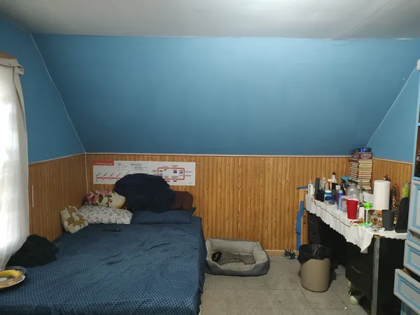 a room with furniture and a walk in closet