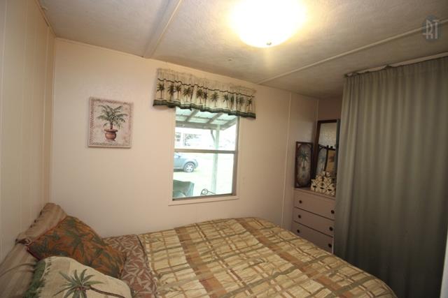 89 Haylee Road Waverly, TN 37185 - Photo 5 of 6 a bedroom with a bed and a window