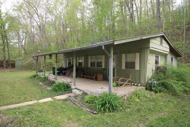 89 Haylee Road Waverly, TN 37185 - Photo 6 of 6 a view of a house with backyard garden and sitting area