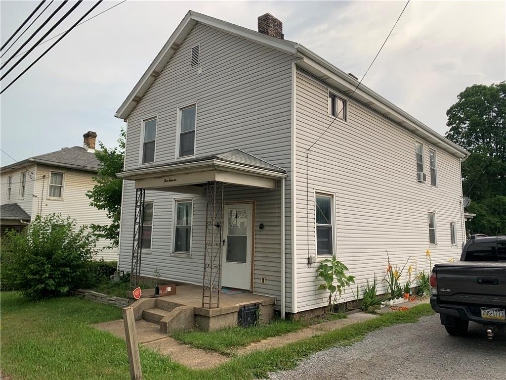 511 Virginia Avenue Rochester, PA 15074 - Photo 1 of 19 a front view of a house with a garden