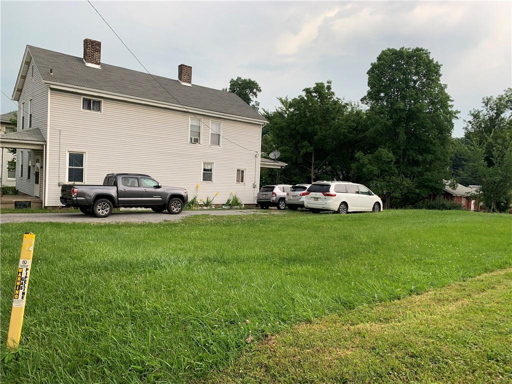511 Virginia Avenue Rochester, PA 15074 - Photo 2 of 19 a front view of a house with a garden