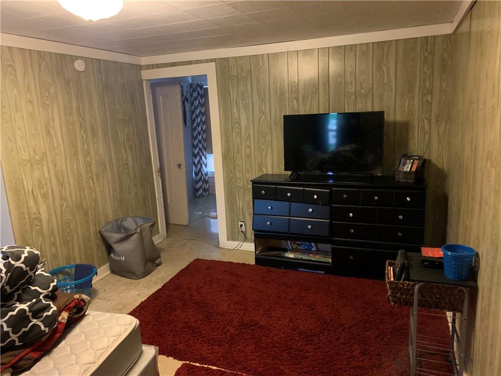 511 Virginia Avenue Rochester, PA 15074 - Photo 14 of 19 a living room with furniture and a flat screen tv