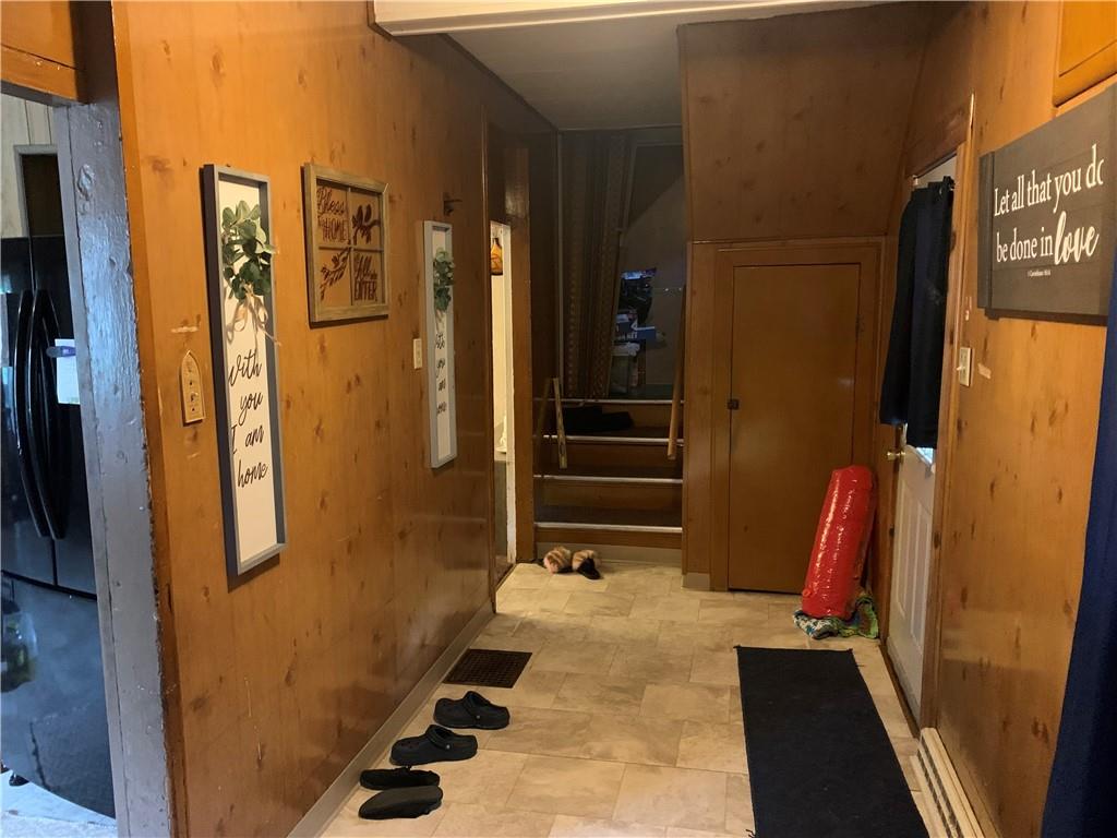 511 Virginia Avenue Rochester, PA 15074 - Photo 16 of 19 a view of walk in closet with clothes and shoes