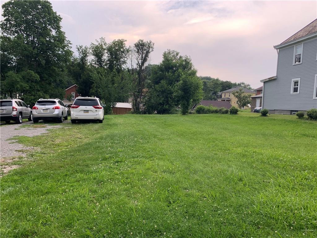 511 Virginia Avenue Rochester, PA 15074 - Photo 3 of 19 a car parked in the middle of a field