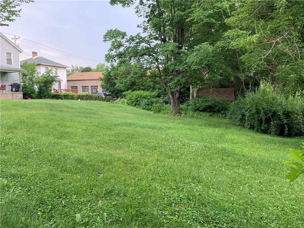 511 Virginia Avenue Rochester, PA 15074 - Photo 4 of 19 a view of a big yard next to a building