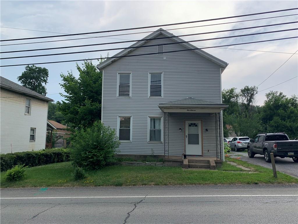 511 Virginia Avenue Rochester, PA 15074 - Photo 6 of 19 a view of a house with a yard plants and large tree