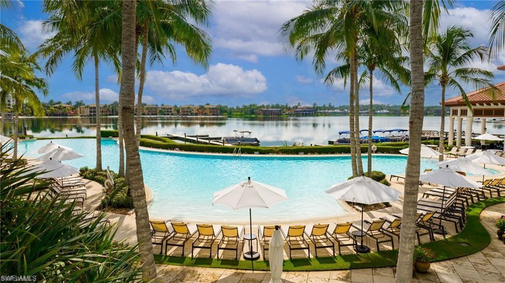 17887 Modena Road Miromar Lakes, FL 33913 - Photo 24 of 36 a view of a lake with a palm trees