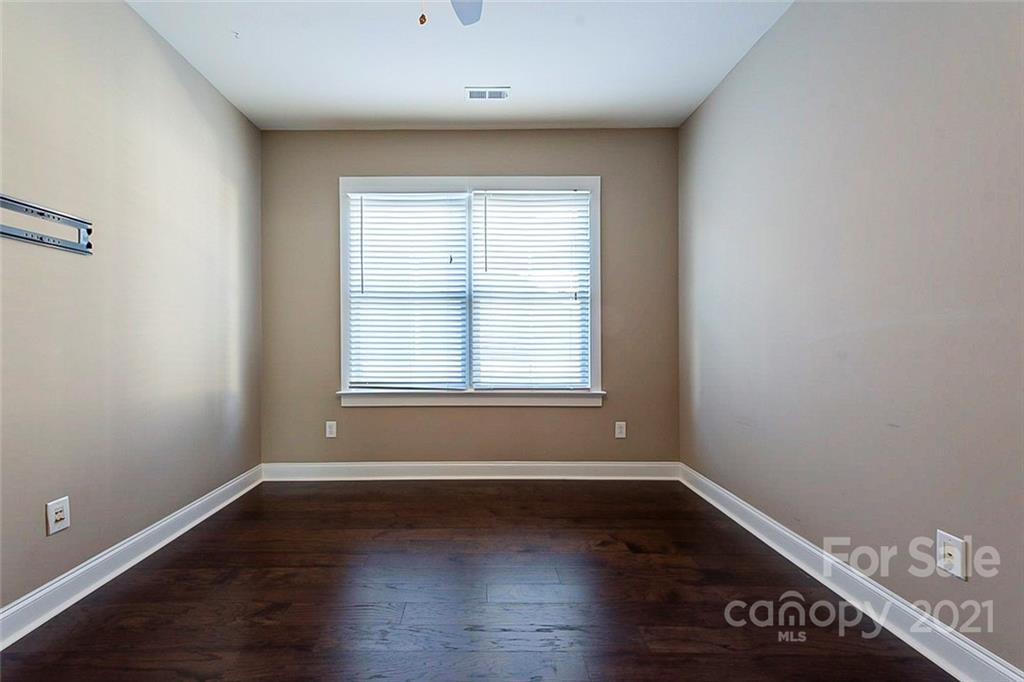 535 Fourth Baxter Crossing Fort Mill, SC 29708 - Photo 15 of 23 wooden floor in an empty room with a window
