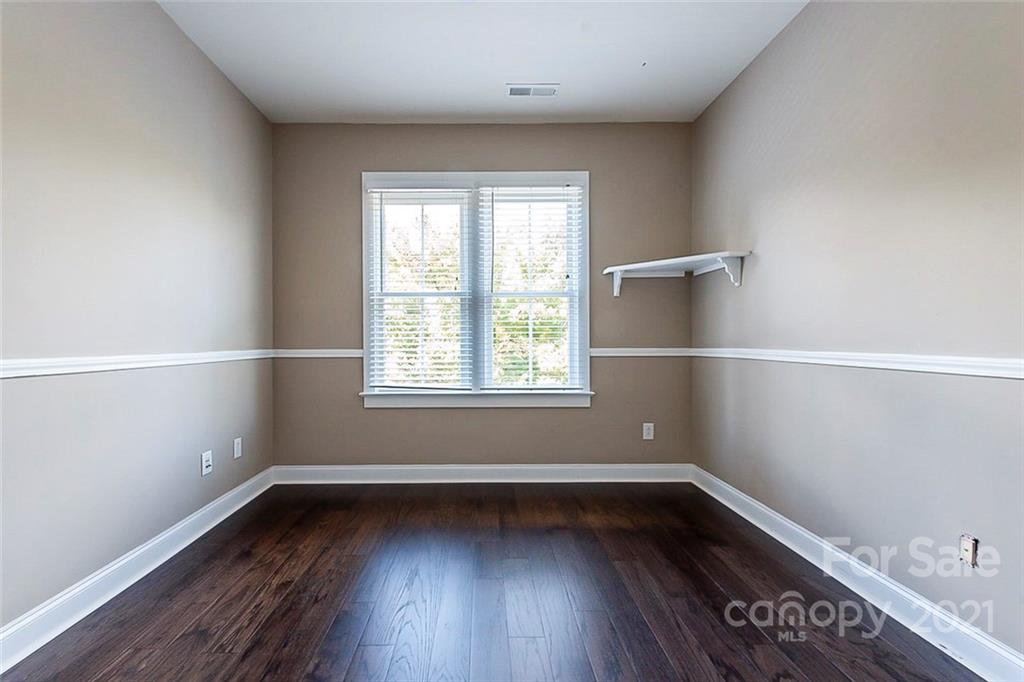 535 Fourth Baxter Crossing Fort Mill, SC 29708 - Photo 17 of 23 an empty room with wooden floor and window