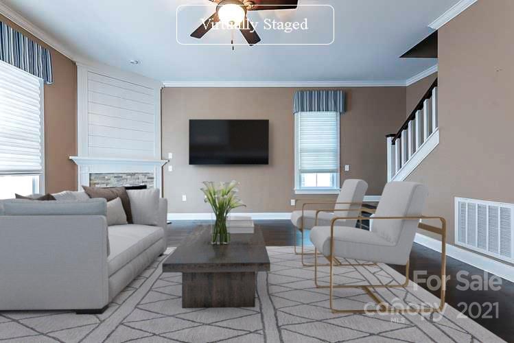535 Fourth Baxter Crossing Fort Mill, SC 29708 - Photo 2 of 23 a living room with furniture and a flat screen tv