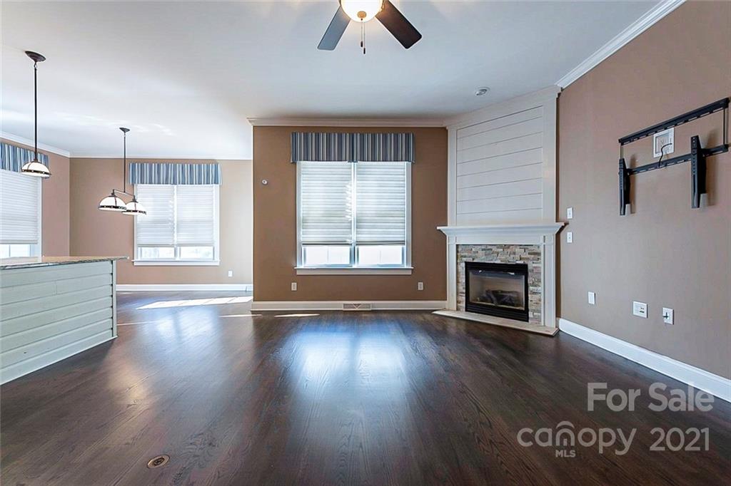 535 Fourth Baxter Crossing Fort Mill, SC 29708 - Photo 5 of 23 a view of an empty room with window and wooden floor