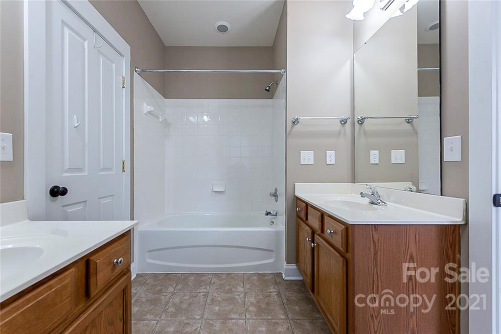 535 Fourth Baxter Crossing Fort Mill, SC 29708 - Photo 6 of 23 a bathroom with a sink and a mirror
