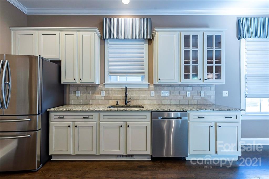 535 Fourth Baxter Crossing Fort Mill, SC 29708 - Photo 8 of 23 a kitchen with stainless steel appliances granite countertop a sink stove and refrigerator