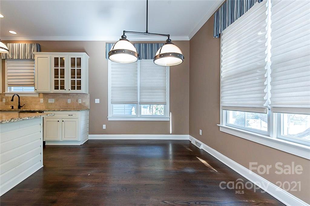 535 Fourth Baxter Crossing Fort Mill, SC 29708 - Photo 9 of 23 a view of an empty room with a window and wooden floor