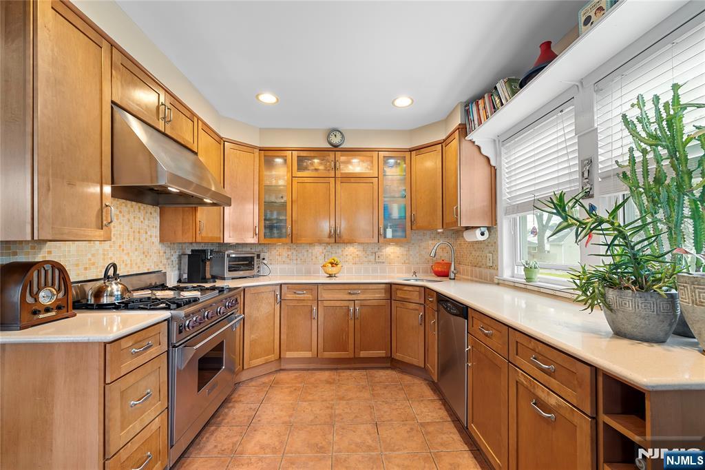 5 Leo Terrace Bloomfield, NJ 07003 - Photo 7 of 32 a kitchen with a sink stove and cabinets