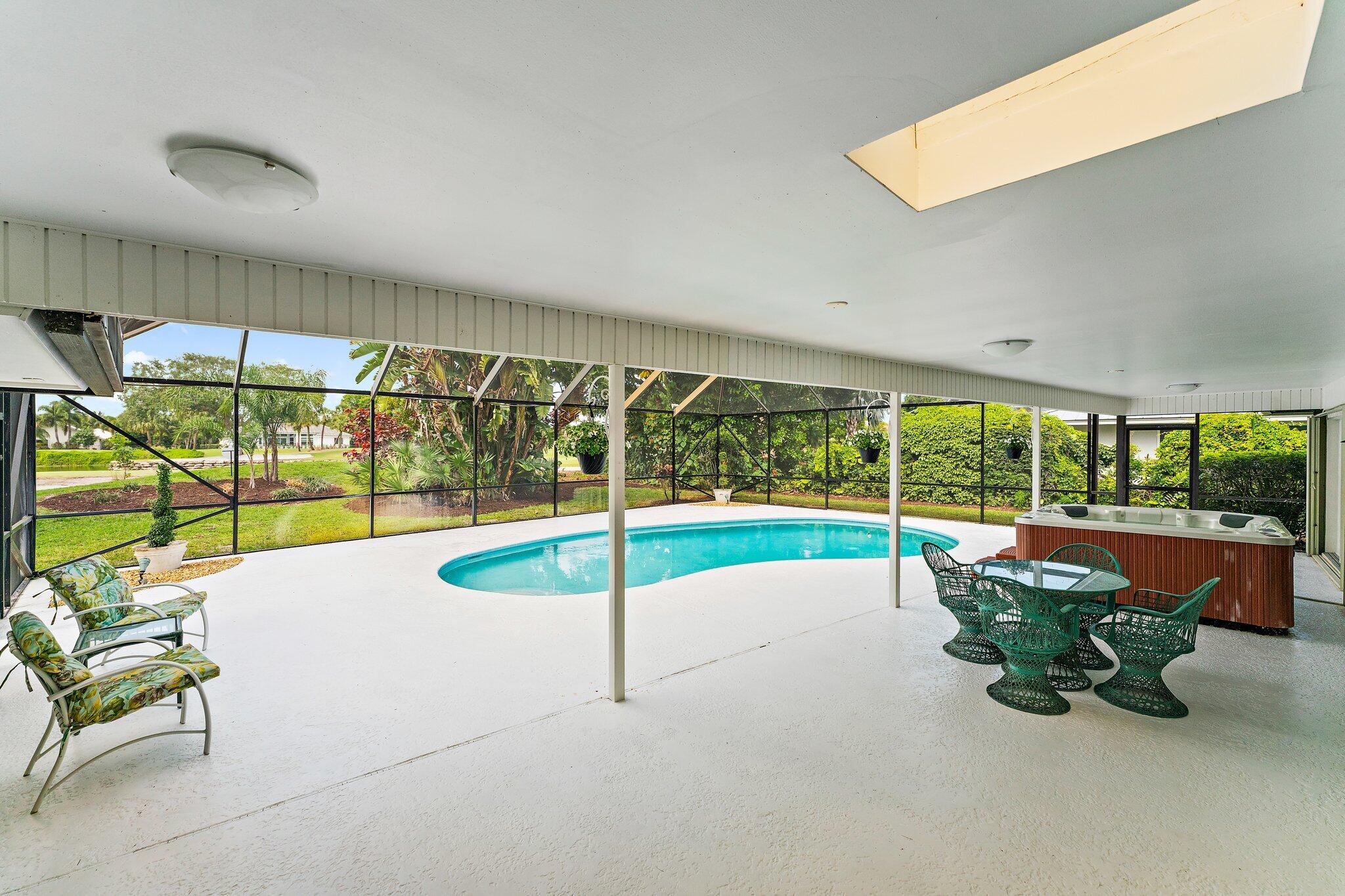 80 Southeast Turtle Creek Drive Jupiter, FL 33469 - Photo 19 of 23 a white bench sitting in front of a building