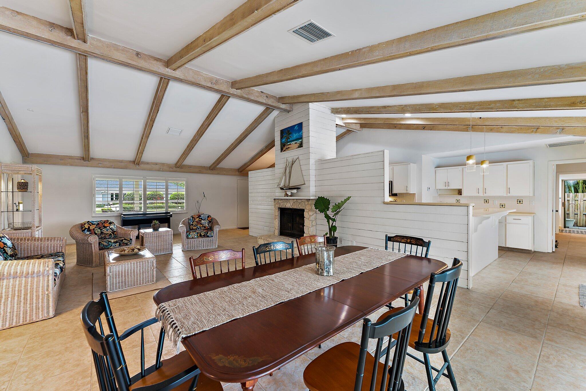 80 Southeast Turtle Creek Drive Jupiter, FL 33469 - Photo 10 of 23 a view of a dining room with furniture window and wooden floor